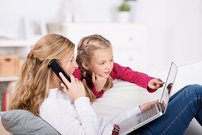 Mom and daughter calling East Tennessee Children's Hospital's Physician Referral line