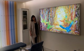 Rachael McCampbell and her artwork, "Forest Glow"