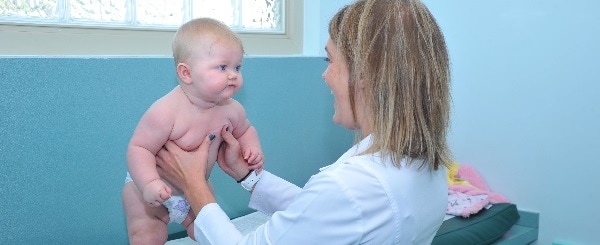 Kelsey May, NP with a young patient