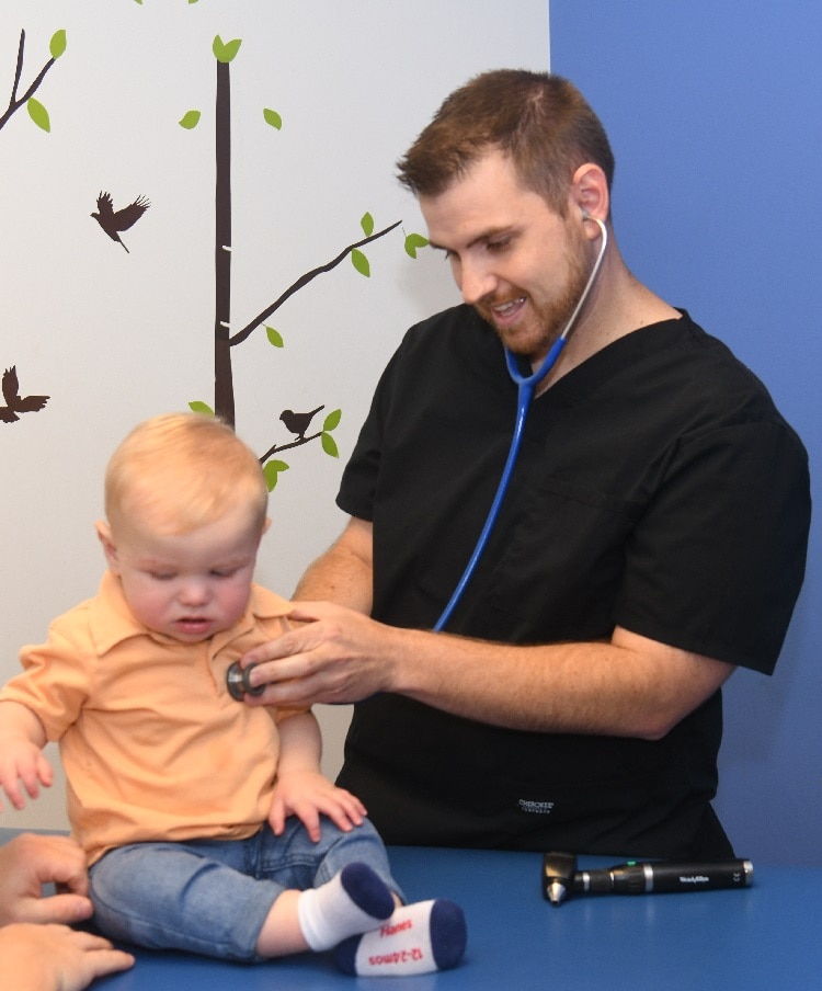 Dr. Justin Widner examines young Canaan at Claiborne County Pediatrics